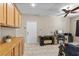 Flex space boasts ample cabinets, desk space, and an exercise bike with natural light from windows at 8563 Red Diamond St, Las Vegas, NV 89123