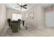 Bright home office featuring neutral walls, tile floors, a ceiling fan, and modern decor at 8563 Red Diamond St, Las Vegas, NV 89123