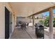 Relaxing covered patio with ample space for entertaining, featuring a barbecue grill at 8563 Red Diamond St, Las Vegas, NV 89123