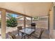 Inviting covered patio with a table and chairs, perfect for outdoor dining at 8563 Red Diamond St, Las Vegas, NV 89123