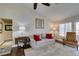 Cozy living room with hardwood floors, a comfortable sofa, and natural light, perfect for relaxation at 8808 Litchfield Ave, Las Vegas, NV 89134