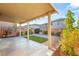 The landscaped backyard has a covered patio and well manicured landscaping at 8930 W Ford Ave, Las Vegas, NV 89148