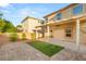 Backyard with a covered patio, artificial turf, and brick pavers at 8930 W Ford Ave, Las Vegas, NV 89148