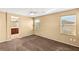 Bedroom featuring carpet floors, a ceiling fan and connecting door to the bathroom at 8930 W Ford Ave, Las Vegas, NV 89148