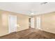 Spacious bedroom with ceiling fan, plush carpeting, and neutral paint at 8930 W Ford Ave, Las Vegas, NV 89148