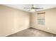 Bedroom with neutral walls, ceiling fan, carpet flooring, and window at 8930 W Ford Ave, Las Vegas, NV 89148