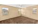 Bright bedroom with multiple windows and carpet floors creating a cozy space at 8930 W Ford Ave, Las Vegas, NV 89148