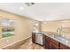Kitchen showcasing granite counters, stainless steel dishwasher and sink with natural light at 8930 W Ford Ave, Las Vegas, NV 89148