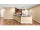 Open-concept kitchen with stainless appliances and a granite counter top, seamlessly flowing to the living area at 8930 W Ford Ave, Las Vegas, NV 89148