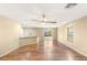 Bright, open living area with hardwood flooring, fan, and plenty of natural light at 8930 W Ford Ave, Las Vegas, NV 89148