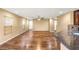 Inviting living space offering abundant natural light and hardwood flooring, adjacent to the kitchen at 8930 W Ford Ave, Las Vegas, NV 89148