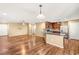 Open floor plan with hardwood floors connecting the living and kitchen areas at 8930 W Ford Ave, Las Vegas, NV 89148