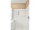 A white, tiled walk-in shower with chrome fixtures and a clear glass enclosure at 8930 W Ford Ave, Las Vegas, NV 89148