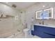 Beautiful bathroom features a glass shower, niche, and modern vanity with a lighted mirror at 905 Smith St, Las Vegas, NV 89108