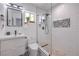 Modern bathroom features a glass enclosed shower, unique floor tile, and updated fixtures at 905 Smith St, Las Vegas, NV 89108