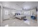 A bright main bedroom featuring recessed lighting, ceiling fan, and a large window with plantation shutters at 905 Smith St, Las Vegas, NV 89108