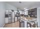 Modern kitchen with stainless steel appliances, granite countertops, and stylish backsplash at 905 Smith St, Las Vegas, NV 89108