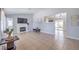 Spacious living room with fireplace, tile flooring, and backyard view at 905 Smith St, Las Vegas, NV 89108