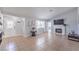 Open living room with fireplace, tile flooring, and natural light at 905 Smith St, Las Vegas, NV 89108