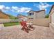Beautiful backyard with artificial turf, patio, and outdoor seating area at 9131 Grand Sunburst Ct, Las Vegas, NV 89149