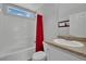 Bright bathroom featuring a white tile shower-tub combination and granite countertop at 9131 Grand Sunburst Ct, Las Vegas, NV 89149