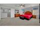 Bright bedroom with ceiling fan, carpet, and natural light from windows at 9131 Grand Sunburst Ct, Las Vegas, NV 89149