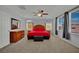 Spacious bedroom featuring a ceiling fan, carpet, and ample natural light at 9131 Grand Sunburst Ct, Las Vegas, NV 89149
