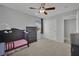 bedroom with crib, dresser, and ceiling fan at 9131 Grand Sunburst Ct, Las Vegas, NV 89149