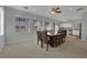 Spacious dining room featuring neutral colors and ample natural light from the multiple windows at 9131 Grand Sunburst Ct, Las Vegas, NV 89149