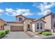 Charming two-story home with well-maintained landscaping and a two-car garage at 9131 Grand Sunburst Ct, Las Vegas, NV 89149