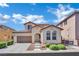 Charming two-story home with well-maintained landscaping and a two-car garage at 9131 Grand Sunburst Ct, Las Vegas, NV 89149