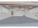 Well-maintained garage with ample storage cabinets and a clean, painted floor at 9131 Grand Sunburst Ct, Las Vegas, NV 89149