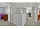 Hallway with carpet and view of a well-lit office space and bedrooms at 9131 Grand Sunburst Ct, Las Vegas, NV 89149