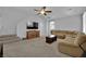Inviting living room with plush sectional sofa, and modern media center, perfect for relaxation at 9131 Grand Sunburst Ct, Las Vegas, NV 89149