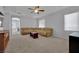 Spacious living room with neutral decor, plush sectional seating, and seamless flow at 9131 Grand Sunburst Ct, Las Vegas, NV 89149