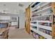 Walk-in pantry featuring custom-built shelving and storage for dry goods at 9131 Grand Sunburst Ct, Las Vegas, NV 89149