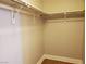 Walk-in closet with shelving and rods for ample storage and organization at 9321 Lady Finger Ct, Las Vegas, NV 89149