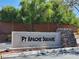 Stone community sign for FT Apache Square surrounded by mature trees and lush landscaping at 9321 Lady Finger Ct, Las Vegas, NV 89149