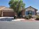 Charming single-story home featuring a well-manicured yard and a spacious two-car garage at 9321 Lady Finger Ct, Las Vegas, NV 89149