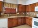Kitchen area showcasing a dishwasher and wooden cabinetry at 9321 Lady Finger Ct, Las Vegas, NV 89149
