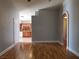 Open-concept living room featuring hardwood floors and an archway to the kitchen area at 9321 Lady Finger Ct, Las Vegas, NV 89149