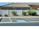 Designated handicap parking spots behind a vinyl fence line and mature landscaping at 9321 Lady Finger Ct, Las Vegas, NV 89149