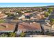 Aerial shot features backyard oasis, covered patio, inground pool and mature palm trees at 9612 Glengarry Dr, Las Vegas, NV 89129