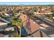 Birds eye view of lush backyard with a sparkling swimming pool, spa and desert landscaping at 9612 Glengarry Dr, Las Vegas, NV 89129