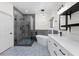 A stunning bathroom with a glass-enclosed shower, freestanding tub, and stylish blue-patterned tile flooring at 9612 Glengarry Dr, Las Vegas, NV 89129