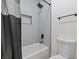 Modern bathroom with a tiled shower featuring a black shower head and a built-in niche at 9612 Glengarry Dr, Las Vegas, NV 89129