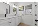Elegant bathroom showcasing double sinks, modern fixtures, and a wall-mounted towel rack at 9612 Glengarry Dr, Las Vegas, NV 89129