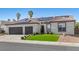Charming home featuring a two-car garage, tile roof, solar panels, and well-manicured lawn at 9612 Glengarry Dr, Las Vegas, NV 89129