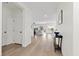 Open hallway featuring light-colored wood flooring and ample natural light flowing through the home at 9612 Glengarry Dr, Las Vegas, NV 89129