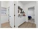 Hallway features built-in cabinets and shelves, with doorway access to a bedroom at 9612 Glengarry Dr, Las Vegas, NV 89129